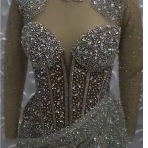 Dress is very beautiful and sparkly, beaded down